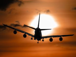 Airplane landing in the sunrise at Philadelphia International Airport near Kingswick Apartments